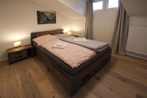 Postel nebo postele na pokoji v ubytování Haus Fichtl, Alpenblick 402 oder Nebelhornblick 403