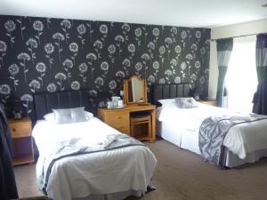 A bed or beds in a room at Affcot Lodge 
