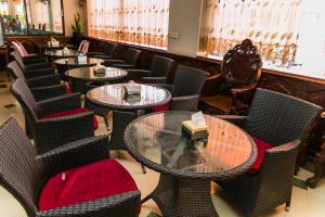 a row of tables and chairs in a restaurant at Star Hotel in Battambang