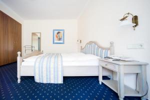 Säng eller sängar i ett rum på Hotel Aselager Mühle