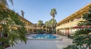 an exterior view of a resort with a swimming pool at Red Roof Inn Tampa Bay - St. Petersburg in St. Petersburg