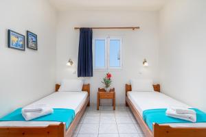 Posteľ alebo postele v izbe v ubytovaní Mylos Apartments Anissaras + 30 fotografií