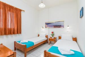 Posteľ alebo postele v izbe v ubytovaní Mylos Apartments Anissaras