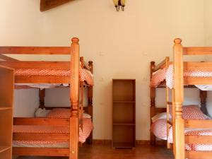 En eller flere senge i et værelse på Hostel El Lago, Caceres
