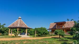 a house with a gazebo in front of it at Cozycomo Chiang Dao - Pha Mok in Amphoe Chiang Dao