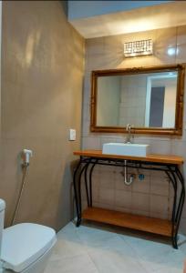 a bathroom with a sink and a mirror at Barra Beach in Rio de Janeiro
