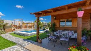 a backyard with a pool and a house at Casa Alegria Almayate Alto by Ruralidays in Almayate Alto