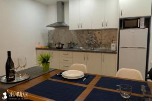 a kitchen with a table with a plate on it at UrbanLux Feria in Albacete