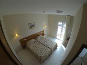 מיטה או מיטות בחדר ב-Hotel Tamasite