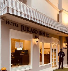 a police officer standing in front of a hotel at Hotel Jukaso Inn Down Town in New Delhi