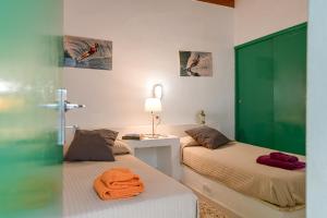 Postel nebo postele na pokoji v ubytování Villa Flores