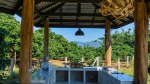 a pavilion with a view of a forest at Cozycomo Chiang Dao - Pha Mok in Amphoe Chiang Dao