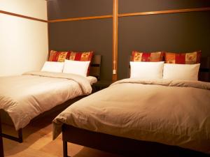 Postelja oz. postelje v sobi nastanitve Mansion Daini Shiratori - Vacation STAY 9658