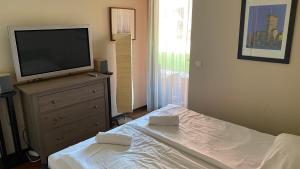Posteľ alebo postele v izbe v ubytovaní Prime Apartmans + 18 fotografií