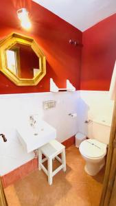 a bathroom with a white sink and a toilet at Hostel Plaza Mayor Corredera in Córdoba