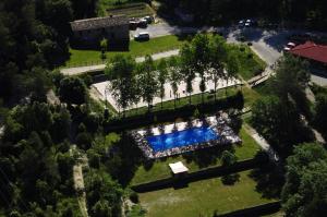an overhead view of a large estate with a swimming pool at El Xalió in Sant Miquel de Campmajor