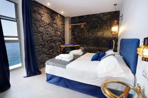 Postel nebo postele na pokoji v ubytování Hotel Puntagrande