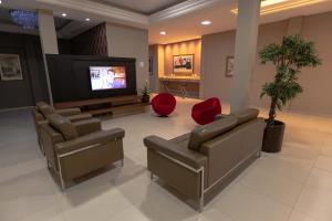 TV a/nebo společenská místnost v ubytování Hotel Foz do Iguaçu