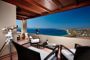 a view of the ocean from a balcony with a camera at Tower Resort Naxos Island in Plaka