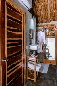 a kitchen with a sink and a cabinet at Casa Mate BeachFront Cabañas El Cuyo in El Cuyo