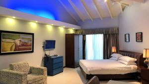 Quints Travelers Inn 객실 침대