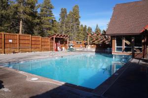 a swimming pool in a yard with a house at Trails End Condo in Breckenridge
