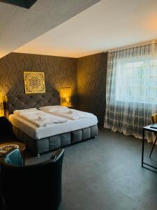 Postel nebo postele na pokoji v ubytování DUA Hotel