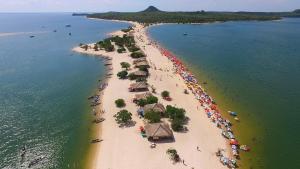 an aerial view of a beach with people on it at Casa Ondas de Alter in Alter do Chao