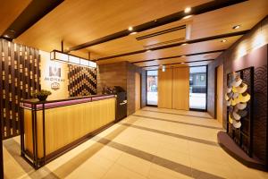a lobby of a restaurant with a reception desk at MONday Apart Premium AKIHABARA ASAKUSABASHI Sta. in Tokyo