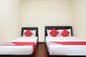 Cama o camas de una habitación en OYO 89928 Acf Guest House