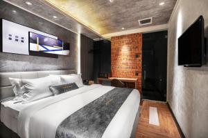 TV a/nebo společenská místnost v ubytování A&R Urban Hotel + 37 fotografií