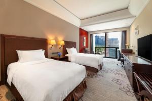Televiisor ja/või meelelahutuskeskus majutusasutuses Jin Jiang International Hotel Xi'an
