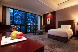 Postel nebo postele na pokoji v ubytování Jin Jiang International Hotel Xi'an + 32 fotografií
