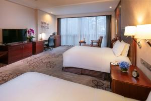 Voodi või voodid majutusasutuse Jin Jiang International Hotel Xi'an toas
