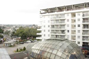 a glass dome in front of a building at Spacious Studio Room at Gateway Pasteur Apartment near Exit Toll Pasteur By Travelio in Bandung
