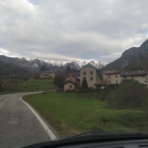 a view of a road with mountains in the background at Agriturismo Val di Ferro in Arsiero