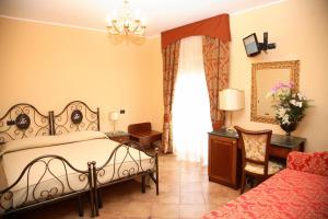 Cama ou camas em um quarto em Agostiniana Hotel