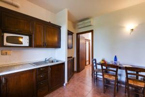 Kuchyň nebo kuchyňský kout v ubytování Borgo Magliano Resort