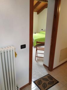 Postel nebo postele na pokoji v ubytování Agriturismo Val di Ferro