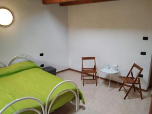 Postel nebo postele na pokoji v ubytování Agriturismo Val di Ferro