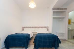 Letto o letti in una camera di BOHEMIA SANLUCAR