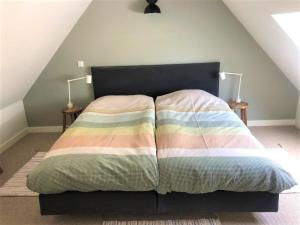 Postel nebo postele na pokoji v ubytování UNIEK Bommelgaard, guesthouse in het prachtige Rivierenland!