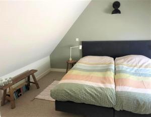 Postel nebo postele na pokoji v ubytování UNIEK Bommelgaard, guesthouse in het prachtige Rivierenland!