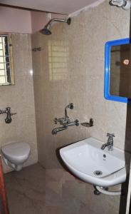 Koupelna v ubytování Hotel Avisha