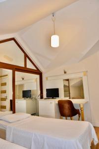 Ένα ή περισσότερα κρεβάτια σε δωμάτιο στο Barby Butik Otel