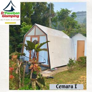 a house with a tent on the side of it at D'Paseban Glamping in Bogor