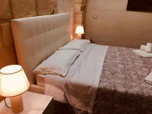 Postel nebo postele na pokoji v ubytování Dimore di Lecce - La Corte