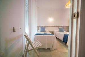 Letto o letti in una camera di BOHEMIA SANLUCAR
