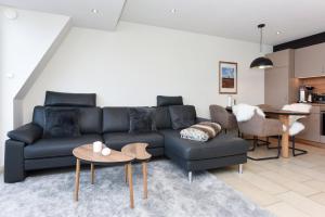 Ein Sitzbereich in der Unterkunft Meerblick-Ferienwohnung Black Pearl