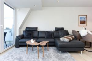 Ein Sitzbereich in der Unterkunft Meerblick-Ferienwohnung Black Pearl